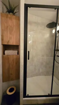 a shower with a glass door in a bathroom at Appartement proche télécabine! Séjour tout inclu! in Les Contamines-Montjoie