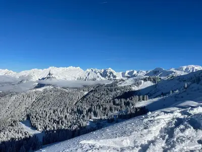 a ski lift with the sun in the background at Le Marlotte in Les Carroz d'Araches