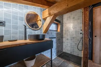 a bathroom with a sink and a mirror at Chalet ski-in-out face au MontBlanc & Bain nordique in Megève