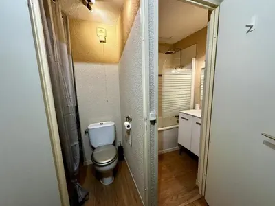 a small bathroom with a toilet and a sink at Les Esserts au pied des pistes idéal 4 personnes in Morillon