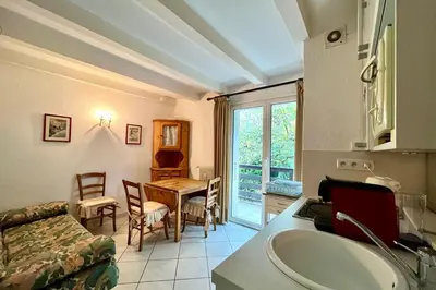 a living room with a table and a couch at Apartment 2 rooms near the slopes in Combloux