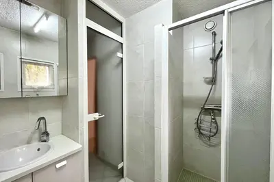 a bathroom with a shower and a sink at Apartment 2 rooms near the slopes in Combloux