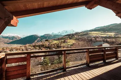 a view from the deck of a cabin at Belmont - New & ecological chalet in the heart of Combloux in Combloux