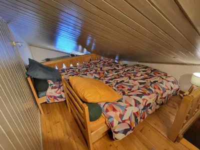 a bedroom with a bed in a room at Studio Mezzanine Les Combettes E in Les Contamines-Montjoie