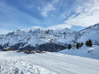 a group of people skiing down a snow covered mountain at Studio Mezzanine Les Combettes E in Les Contamines-Montjoie