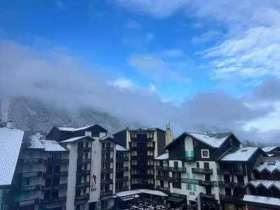 a group of buildings with snow on their roofs at Le Triolet - Centre-ville - Balcon avec vue in Chamonix-Mont-Blanc