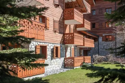 a building with balconies on the side of it at Résidence Les Fermes du Soleil - maeva Home - Appartement 3 pièces 6 personnes - Prestige MAE-4281 in Arâches-la-Frasse