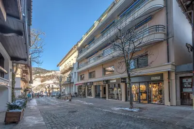 a cobblestone street in a city with buildings at Appartement Cimes Étoilées - Welkeys in Megève