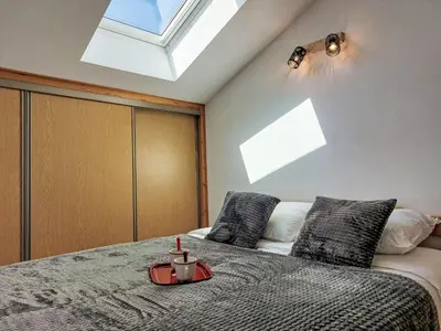 a bedroom with a bed with a skylight at Apartment La coupe de Cristal by Interhome in Saint-Gervais-les-Bains
