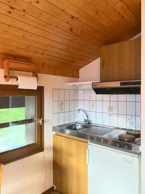 a kitchen with a sink and a counter top at Au cœur des pistes in Saint-Gervais-les-Bains