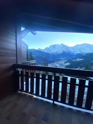 a balcony with a view of mountains in the distance at Au cœur des pistes in Saint-Gervais-les-Bains