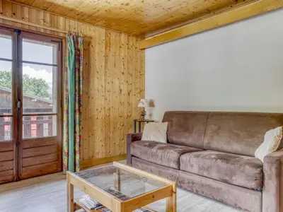 a living room with a couch and a table at Appartement 2 pièces avec 3 balcons et wifi à Megève Centre - FR-1-453-322 in Megève