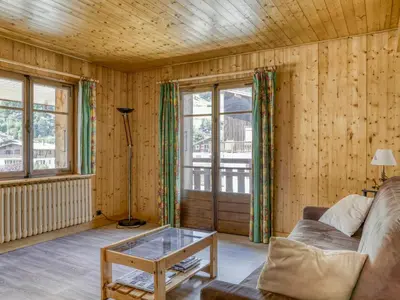 a living room with a couch and a glass table at Appartement 2 pièces avec 3 balcons et wifi à Megève Centre - FR-1-453-322 in Megève