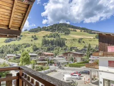 a view from a balcony of a town with a mountain at Appartement 2 pièces avec 3 balcons et wifi à Megève Centre - FR-1-453-322 in Megève