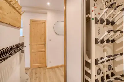 a room with a closet with wine bottles at Chalet 8 personnes in Passy