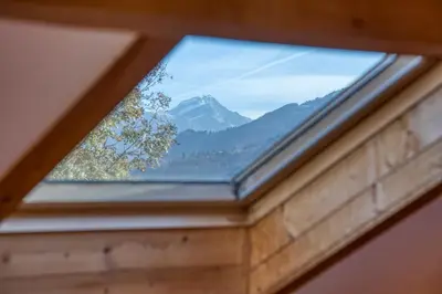 a window with a view of a mountain at Chalet 8 personnes in Passy