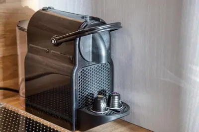 a toaster oven sitting on a shelf next to a wall at Studio 2 personnes in Passy