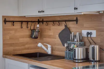 a kitchen counter with a sink in a kitchen at Studio 2 personnes in Passy
