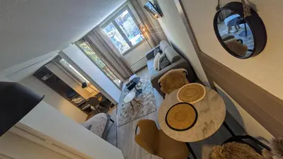 an overhead view of a living room with a table at L'Oursina in Chamonix-Mont-Blanc