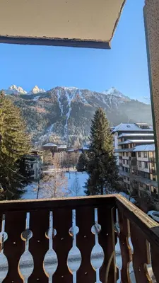 a balcony with a view of a snow covered mountain at L'Oursina in Chamonix-Mont-Blanc