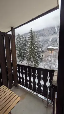 a balcony with a view of a snow covered mountain at L'Oursina in Chamonix-Mont-Blanc