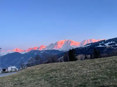a view of a mountain range with red mountains at Grand studio Combloux - Vue Mont Blanc in Combloux