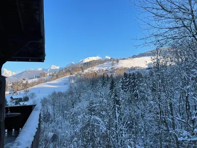 a view of a river in the snow from a house at Grand studio Combloux - Vue Mont Blanc in Combloux