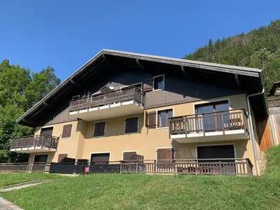 a building with balconies on the side of it at Les fermes de saint gervais in Saint-Gervais-les-Bains