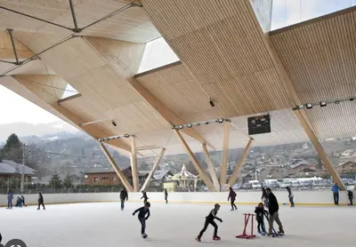 a group of people skating on an ice rink at Le Refuge, Mobil Home 3 rooms avec Climatisation in Samoëns