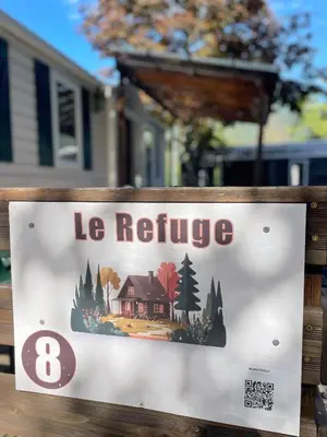 a sign for a house that says la refuge at Le Refuge, Mobil Home 3 rooms avec Climatisation in Samoëns