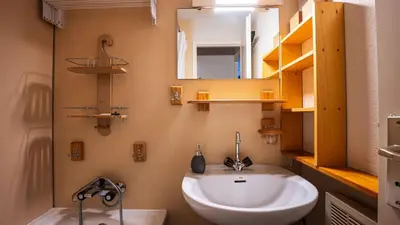 a bathroom with a sink and a mirror at Grande Neige N 33 - 2P5 in Morillon