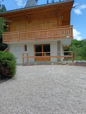 a house with a balcony on top of it at Karibu in Saint-Gervais-les-Bains