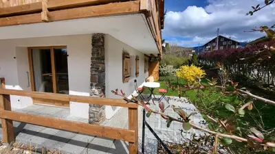 a porch of a house with a wooden fence at Karibu in Saint-Gervais-les-Bains