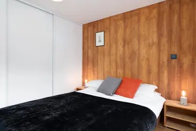 a bedroom with a bed with two pillows on it at The Loft in Saint-Gervais-les-Bains