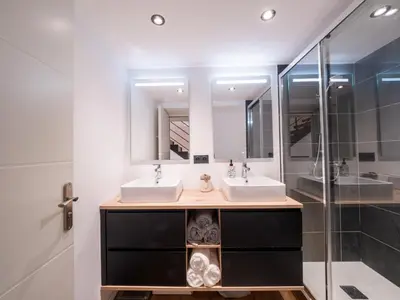 a bathroom with two sinks and a shower at The Loft in Saint-Gervais-les-Bains