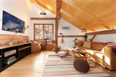 a living room with a couch and a table at The Loft in Saint-Gervais-les-Bains