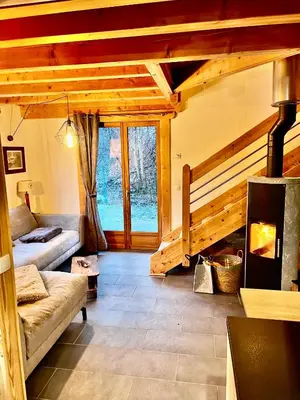 a living room with a couch and a fireplace at Chamlomy in Chamonix-Mont-Blanc