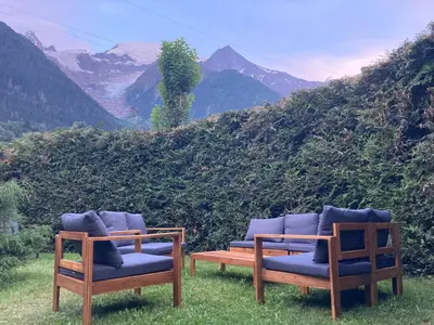 a group of chairs sitting on top of a hill at Chamlomy in Chamonix-Mont-Blanc