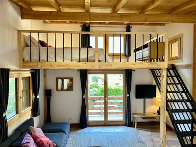 a bedroom with a bunk bed in a room at Private Loft Apartment, Central Chamonix in Chamonix-Mont-Blanc