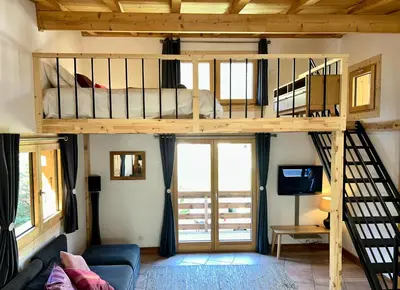a bedroom with a bunk bed in a room at Private Loft Apartment, Central Chamonix in Chamonix-Mont-Blanc