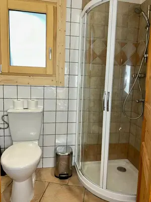 a bathroom with a toilet and a shower at Private Loft Apartment, Central Chamonix in Chamonix-Mont-Blanc