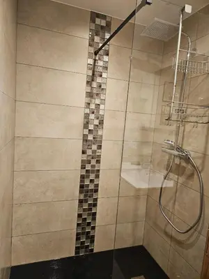 a bathroom with a shower with a glass door at Apartment in Saint-Gervais close to gondola in Saint-Gervais-les-Bains