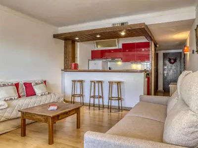 a living room with a couch and a table at Studio cabine à Megève pour 4 pers, avec balcon, animaux admis, proche télécabine - FR-1-453-323 in Megève
