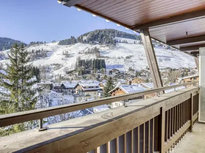 a balcony with a view of a snow covered mountain at Studio cabine à Megève pour 4 pers, avec balcon, animaux admis, proche télécabine - FR-1-453-323 in Megève