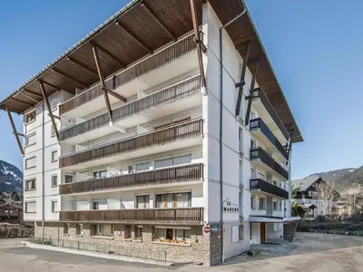 an apartment building with balconies on the side of it at Studio cabine à Megève pour 4 pers, avec balcon, animaux admis, proche télécabine - FR-1-453-323 in Megève