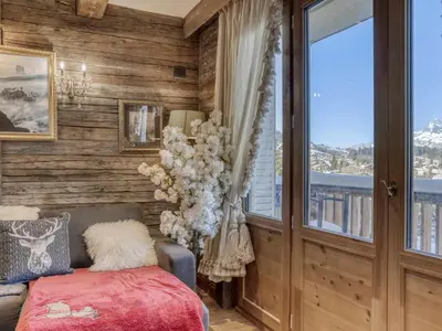 a bedroom with wooden walls and a bed and a window at Appartement Pratique Centre Megève - 4 Pers - Animaux Bienvenus - FR-1-453-324 in Megève