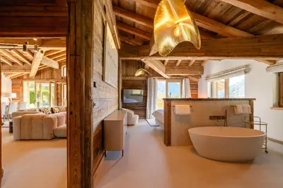 a bathroom with a large tub in a room at Chalet Angel - Chamonix in Chamonix-Mont-Blanc