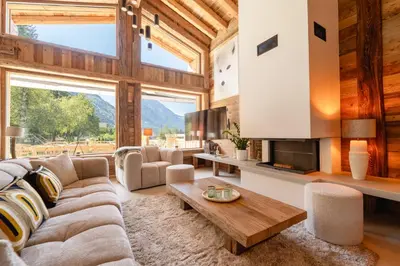 a living room with a couch and a table at Chalet Angel - Chamonix in Chamonix-Mont-Blanc