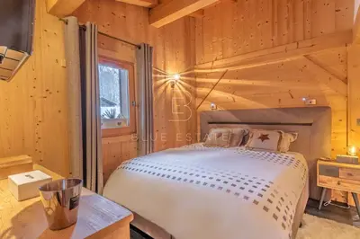 a dining room with a table and chairs at Chalet Le Hameau - Megève in Demi-Quartier