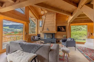 a kitchen with wooden cabinets and a window at Chalet du Jaillet in Demi-Quartier